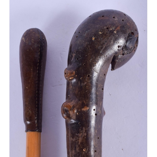 2455 - AN EARLY 20TH CENTURY TWIST WALKING CANE together with another similar. 84 cm long. (2)