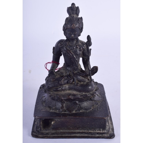 2479 - AN EARLY MIDDLE EASTERN BRONZE FIGURE OF A BUDDHISTIC DEITY modelled upon a square plinth. 14 cm x 7... 