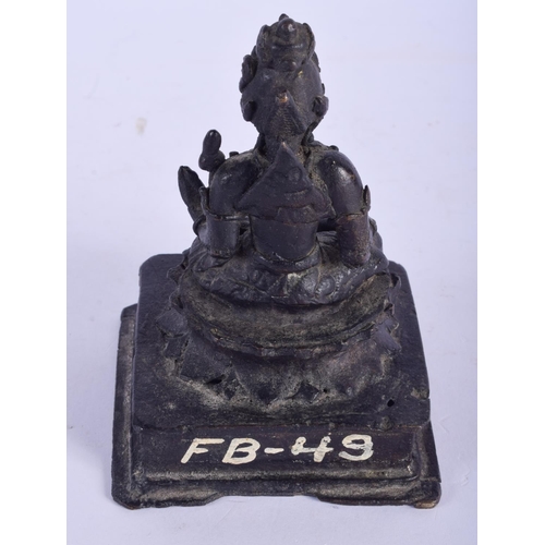 2479 - AN EARLY MIDDLE EASTERN BRONZE FIGURE OF A BUDDHISTIC DEITY modelled upon a square plinth. 14 cm x 7... 