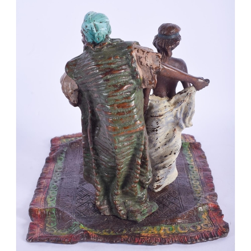 2481 - A CONTEMPORARY COLD PAINTED BRONZE FIGURE OF AN ARABIC MALE modelled upon a carpet. 21 cm x 18 cm.