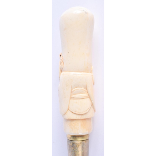 2490 - A CONTINENTAL CARVED BONE WALKING CANE. 96 cm long.