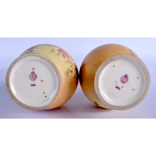 250 - Royal Worcester blush ivory pair of vases of shape 1661, painted with flowers highlighted in gilt da... 