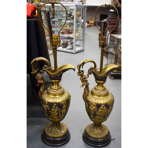 2504 - A LARGE PAIR OF 19TH CENTURY CONTINENTAL BRONZE URNS converted to lamps. 60 cm high not inc fittings... 