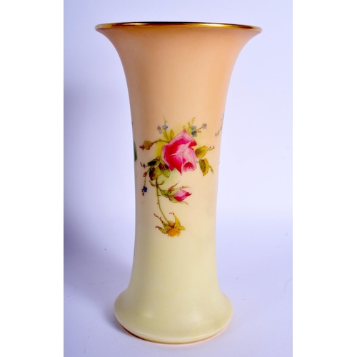 252 - Royal Worcester blush ivory trumpet shaped vase painted with roses and a lily highlighted in white e... 