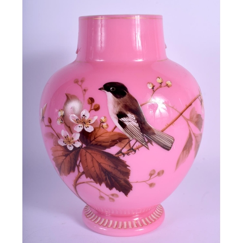 35 - A LATE VICTORIAN/EDWARDIAN PINK OPALINE GLASS VASE enamelled with birds. 21 cm x 13 cm.