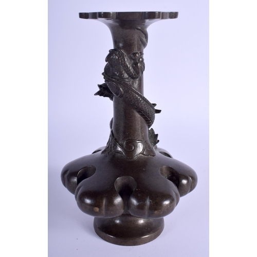 1001 - A 19TH CENTURY JAPANESE MEIJI PERIOD BRONZE LOBED VASE overlaid with an entwined dragon. 19 cm high.