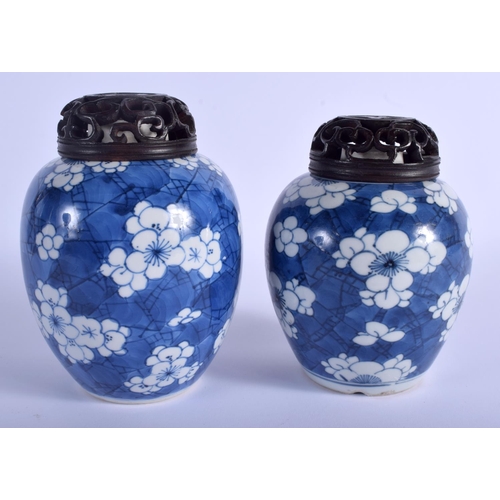 1008 - A NEAR PAIR OF 17TH CENTURY CHINESE BLUE AND WHITE GINGER JARS Kangxi, painted with prunus and flowe... 