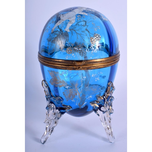 37 - A VICTORIAN EGG SHAPED BLUE GLASS BOX AND COVER enamelled with Mary Gregory. 21 cm high.