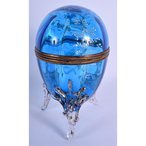 37 - A VICTORIAN EGG SHAPED BLUE GLASS BOX AND COVER enamelled with Mary Gregory. 21 cm high.