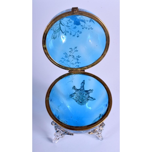 37 - A VICTORIAN EGG SHAPED BLUE GLASS BOX AND COVER enamelled with Mary Gregory. 21 cm high.