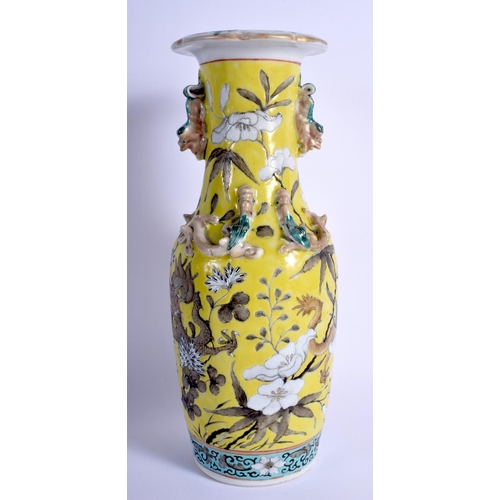 1022 - A 19TH CENTURY CHINESE FAMILLE JAUNE PORCELAIN VASE Qing, painted with dragons and chilong. 26 cm hi... 