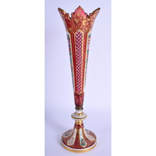 40 - A 19TH CENTURY BOHEMIAN ENAMELLED GLASS VASE painted and jewelled with foliage. 31 cm high.