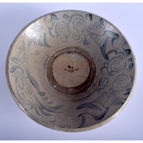 1037 - AN 18TH CENTURY CHINESE VIETNAMESE BLUE AND WHITE STONEWARE BOWL painted with  swirling motifs. 32 c... 