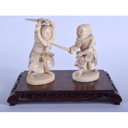 1038 - A PAIR OF 19TH CENTURY JAPANESE MEIJI PERIOD CARVED IVORY SAMURAI modelled upon a hardwood base. Fig... 