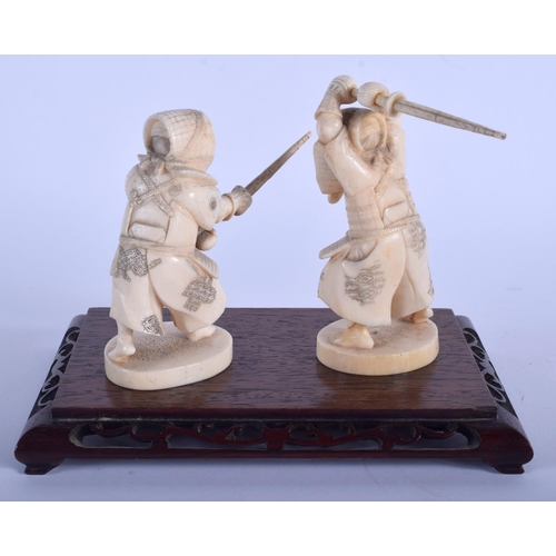 1038 - A PAIR OF 19TH CENTURY JAPANESE MEIJI PERIOD CARVED IVORY SAMURAI modelled upon a hardwood base. Fig... 