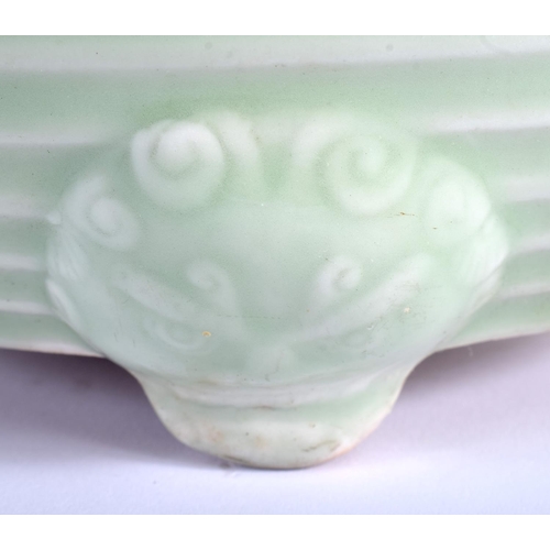 1040 - A LARGE 19TH CENTURY CHINESE CELADON RIBBED CENSER Qing, with highly unusual mask head mounts. 26 cm... 