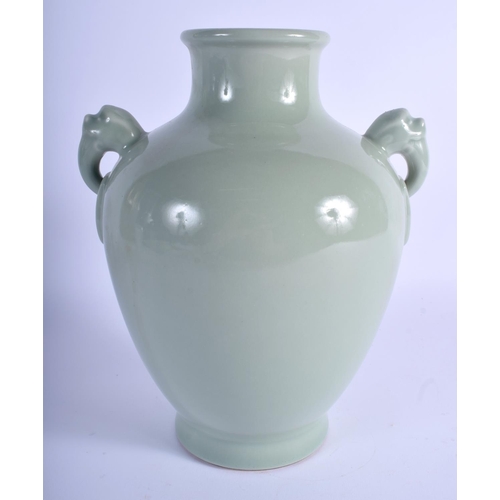 1041 - A CHINESE CELADON TWIN HANDLED PORCELAIN VASE bearing Qianlong marks to base. 24 cm x 14 cm.