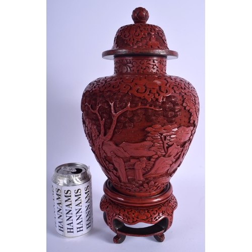 1045 - A RARE 19TH CENTURY CHINESE CARVED CINNABAR LACQUER VASE AND COVER Qing, upon a fitted stand. 37 cm ... 