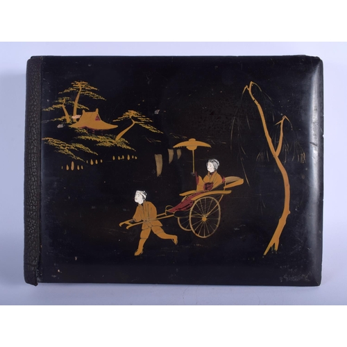 1046 - A LATE 19TH CENTURY JAPANESE MEIJI PERIOD BLACK LACQUER PHOTOGRAPH ALBUM decorated with figures. 35 ... 