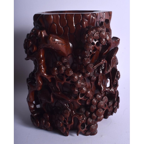 1050 - AN EARLY 20TH CENTURY CHINESE CARVED HARDWOOD BRUSH POT Late Qing/Republic, decorated with birds amo... 