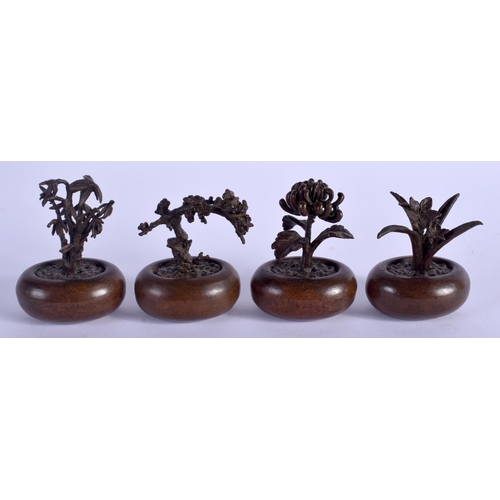 1063 - FOUR JAPANESE BRONZE BONSAI TREE OKIMONO of naturalistic form. Largest 6 cm x 4 cm. (4)