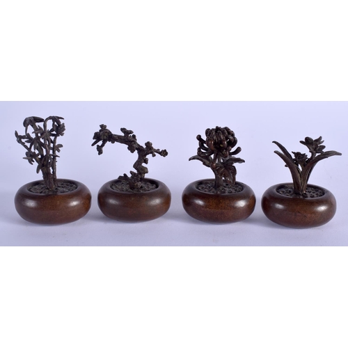 1063 - FOUR JAPANESE BRONZE BONSAI TREE OKIMONO of naturalistic form. Largest 6 cm x 4 cm. (4)