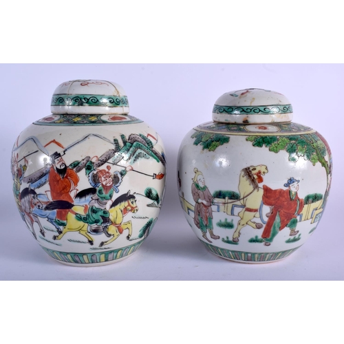 1084 - A PAIR OF 19TH CENTURY CHINESE FAMILLE VERTE GINGER JARS AND COVER painted with warriors. 19 cm x 12... 