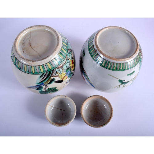 1084 - A PAIR OF 19TH CENTURY CHINESE FAMILLE VERTE GINGER JARS AND COVER painted with warriors. 19 cm x 12... 