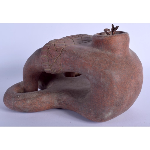 465 - A SOUTH AMERICAN PRE COLUMBIAN POTTERY VESSEL modelled as a male holding his legs. 30 cm x 24 cm.