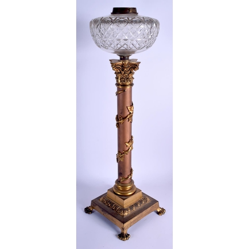 466 - A 19TH CENTURY FRENCH BRONZE CORINTHIAN COLUMN OIL LAMP overlaid with acanthus. 58 cm high.