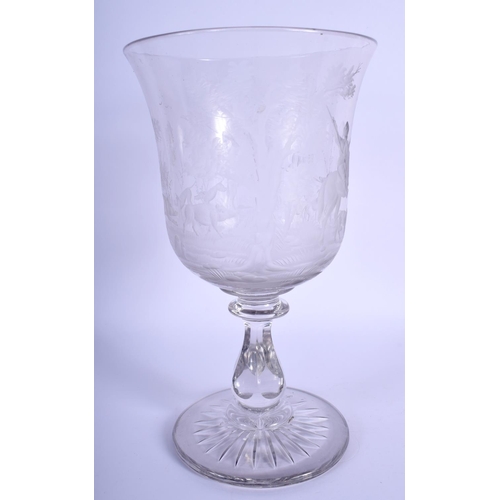 47 - A GOOD LARGE ANTIQUE CRYSTAL GLASS GOBLET engraved with hunting scenes. 27 cm high.