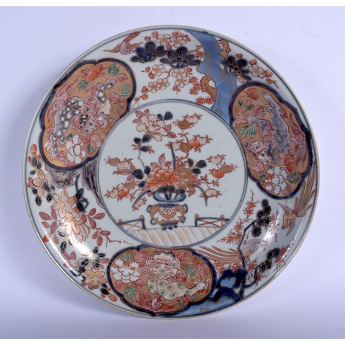 1100 - AN 18TH CENTURY JAPANESE EDO PERIOD IMARI DISH painted with flowers and Buddhistic lions. 28 cm diam... 