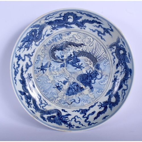 1116 - AN 18TH CENTURY CHINESE BLUE AND WHITE PORCELAIN DISH Qing, bearing Xuande marks to rim, painted wit... 