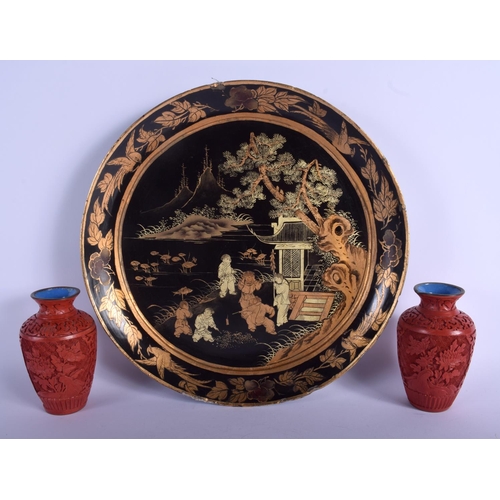 1118 - A PAIR OF EARLY 20TH CENTURY CHINESE CINNABAR LACQUER VASES together with a large dish. Largest 30 c... 