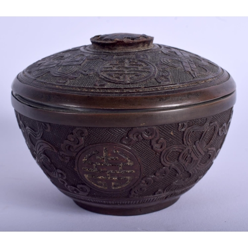 1134 - A CHINESE QING DYNASTY CARVED COCONUT BOX AND COVER decorated with motifs. 7.5 cm diameter.