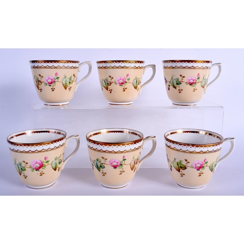 52 - A 19TH CENTURY CONTINENTAL PORCELAIN TEASET painted with flowers upon a cream ground. Largest 24 cm ... 