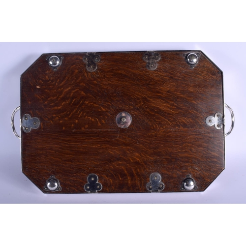 520 - AN EDWARDIAN OAK AND SILVER PLATED SERVING TRAY. 60 cm x 34 cm.