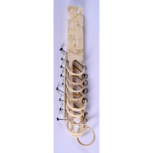 1175 - A 19TH CENTURY CHINESE CARVED CANTON IVORY PUZZLE of figural form. 22.5 cm long.