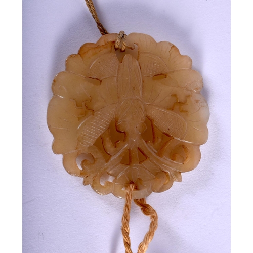 1176 - A 19TH CENTURY CHINESE CARVED JADE AND IVORY PENDANT Qing, carved as a butterfly amongst foliage. Ja... 