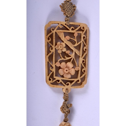 1176 - A 19TH CENTURY CHINESE CARVED JADE AND IVORY PENDANT Qing, carved as a butterfly amongst foliage. Ja... 