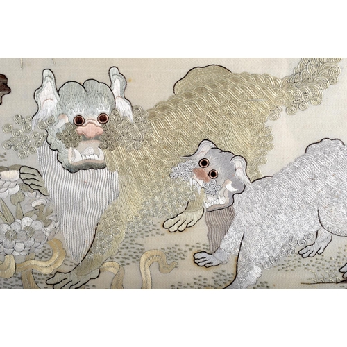 1181 - A GOOD 19TH CENTURY CHINESE SILKWORK EMBROIDERED PANEL Qing, depicting two Buddhistic lions roaming ... 