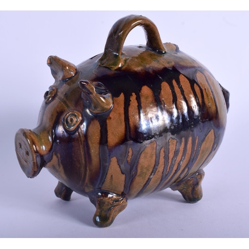 121 - A 19TH CENTURY STAFFORDSHIRE TREACLE GLAZED WHIELDON TYPE MONEY BOX in the form of a pig. 13.5 cm wi... 