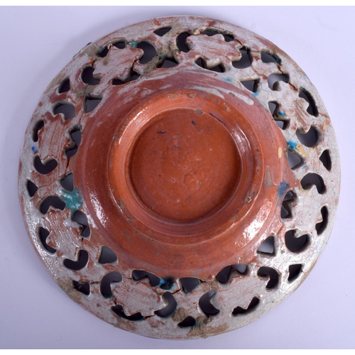 59 - A MIDDLE EASTERN IZNIK FAIENCE TYPE POTTERY VASE together with a similar open work dish. Largest 30 ... 