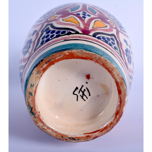 59 - A MIDDLE EASTERN IZNIK FAIENCE TYPE POTTERY VASE together with a similar open work dish. Largest 30 ... 