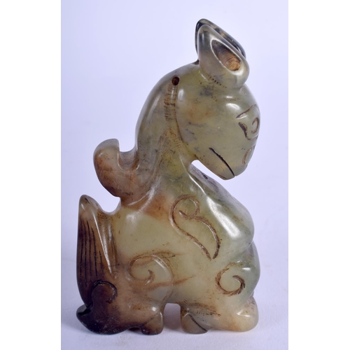 1214 - A CHINESE CARVED JADE FIGURE OF A STYLISED DRAGON 20th Century. 8.5 cm x 6.5 cm.