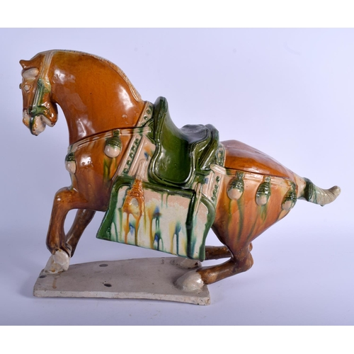 1217 - A LARGE 19TH CENTURY CHINESE SANCAI GLAZED POTTERY FIGURE OF A HORSE Tang Style, modelled upon a sha... 