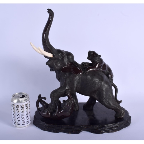 1220 - A 19TH CENTURY JAPANESE MEIJI PERIOD BRONZE OKIMONO modelled as two tigers attacking an elephant. 27... 