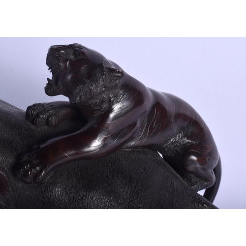 1220 - A 19TH CENTURY JAPANESE MEIJI PERIOD BRONZE OKIMONO modelled as two tigers attacking an elephant. 27... 