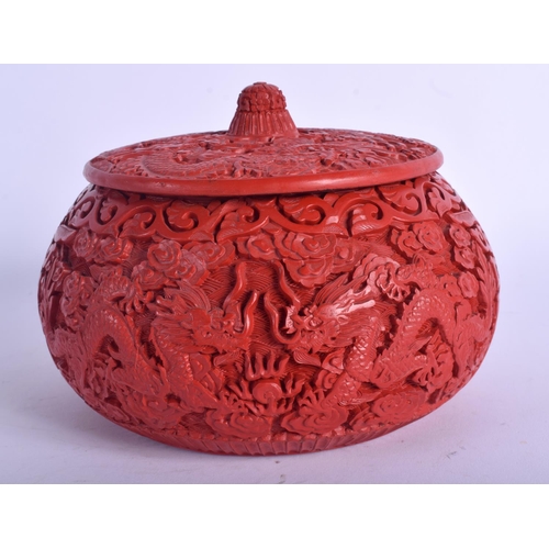 1228 - AN EARLY 20TH CENTURY CHINESE CARVED RED LACQUER BOX AND COVER possibly cinnabar, decorated with dra... 