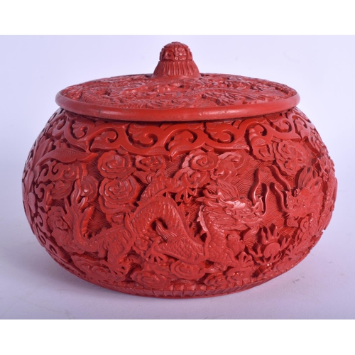 1228 - AN EARLY 20TH CENTURY CHINESE CARVED RED LACQUER BOX AND COVER possibly cinnabar, decorated with dra... 